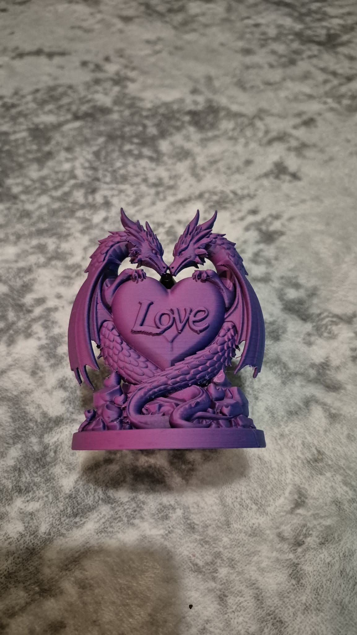 Love dragon statue with heart