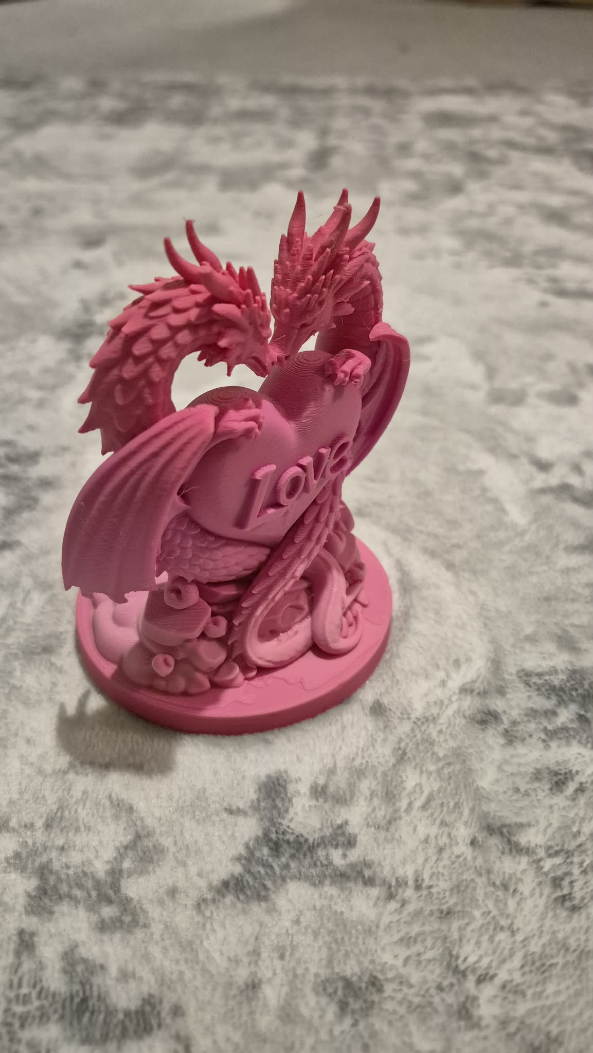 Love dragon statue with heart